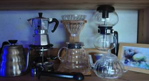 a group of glass appliances sitting on a counter at Spr Guesthouse in Shirahama +12 photos