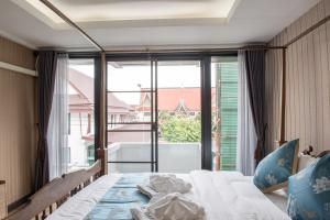 Giường trong phòng chung tại A Lanna Boutique House +108 ảnh