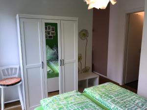 a bedroom with a bed and a closet at Louisenstraße 31 in Dresden