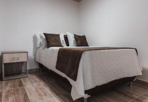 Voodi või voodid majutusasutuse HOTEl PACHAMAMA SPA toas