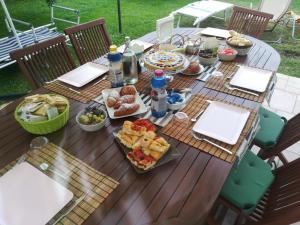 a picnic table with food and drinks on it at B&B Ariadamare in Sanremo