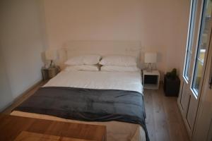 A bed or beds in a room at Maison SAGM&C