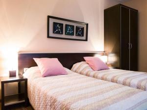 two beds sitting next to each other in a bedroom at YES Varna Studios in Varna City