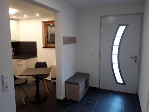 an office with a door and a table and a desk at Relax in Bad Wildbad