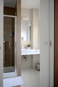 a bathroom with a sink and a shower at B&B Dimora Silvestri in Polignano a Mare