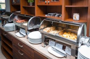 a buffet line with dishes and food on plates at VitaPark Borysfen in Kyiv