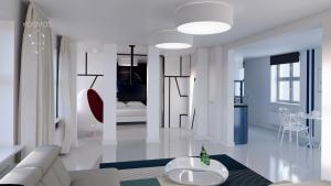 トルンにあるKosmos 9 - Apartament Orbitaの白いリビングルーム(ソファ、テーブル付)