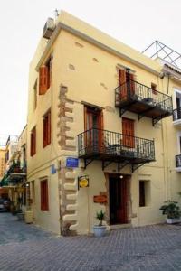 a building with two balconies on the side of it at Hera Studios in Chania Town