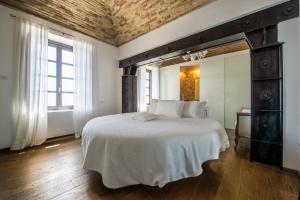 a bedroom with a large bed and a large mirror at Faro Capo Spartivento in Chia