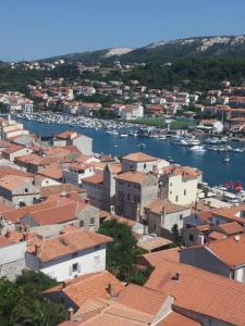 an aerial view of a town with boats in the water at Apartments & Rooms Brna in Rab