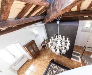 an overhead view of a living room with a chandelier at Urbana 33 in Rome