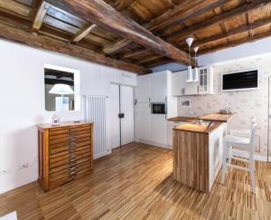 a kitchen with a wooden island in a room at Urbana 33 in Rome