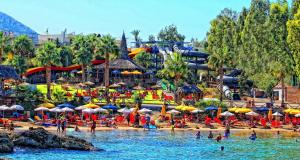 a group of people on the beach at a water park at Litsa's Suite in Heraklio Town
