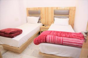 Postel nebo postele na pokoji v ubytování Friends Hostel by Backpackers Heaven- New Delhi Railway Station - Paharganj