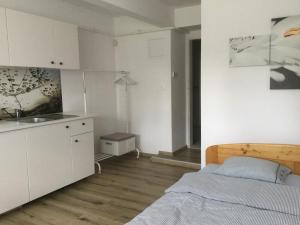 A bed or beds in a room at Vila Horec, Vysne Hagy