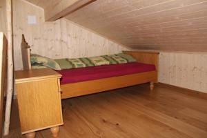 Postel nebo postele na pokoji v ubytování Chalet Nueschwendi
