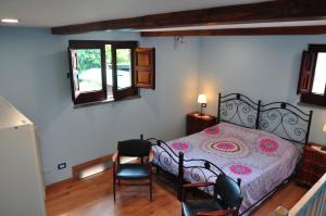 a bedroom with a bed and two chairs at NICE mini House - tra l'Etna Catania Taormina e il Mare in Trecastagni