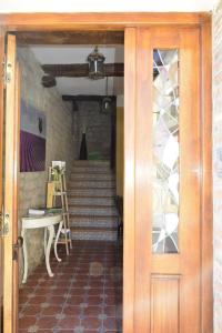 a hallway with a staircase with a door and a stair case at Casa Rural Kandela Etxea in La puebla de Labarca 