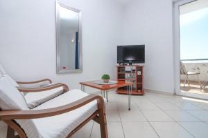 TV a/nebo společenská místnost v ubytování Apartmani Tea