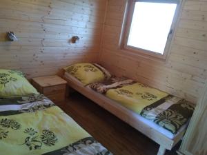 Postel nebo postele na pokoji v ubytování Chata Nový Přerov