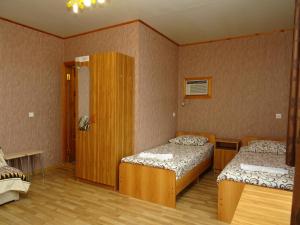 Кровать или кровати в номере Mimoza Guest House