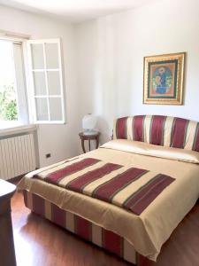 Postel nebo postele na pokoji v ubytování b&b le magnolie