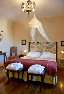 Posteľ alebo postele v izbe v ubytovaní Hotel Santa Coloma del Camino