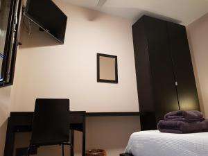 TV a/nebo společenská místnost v ubytování Casa Carol