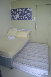 Katil atau katil-katil dalam bilik di 1 Bedroom Condo overlooking taal lake SMDC Wind Residences tagaytay City +33 gambar