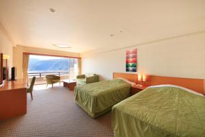 Postel nebo postele na pokoji v ubytování Akazawa Onsen Hotel