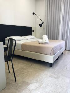 Postel nebo postele na pokoji v ubytování Albergo Milazzo Inn AiMori