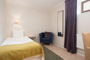 Postel nebo postele na pokoji v ubytování Home Hotel Kung Oscar