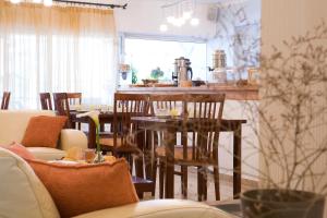 a dining room with a table and chairs at Hotel Grand Nefeli in Vasiliki