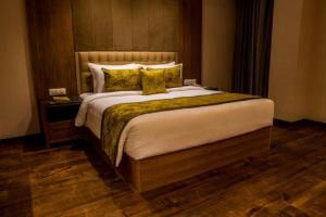 Llit o llits en una habitació de Lemon Tree Hotel Siliguri