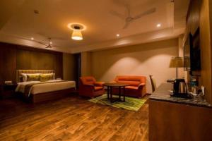 Llit o llits en una habitació de Lemon Tree Hotel Siliguri