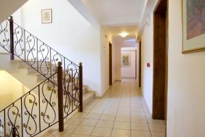 a hallway of a house with a staircase at Hotel Grand Nefeli in Vasiliki
