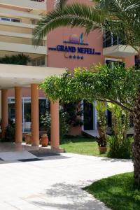 a building with a sign that reads grand meridian at Hotel Grand Nefeli in Vasiliki