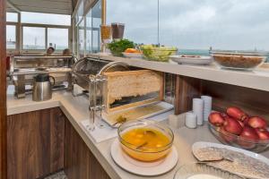 a kitchen with a counter with some food on it at Marcello Hotel in Istanbul