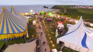 an overhead view of a festival with tents and people at Maddens Bridge Bar & Guesthouse in Bundoran