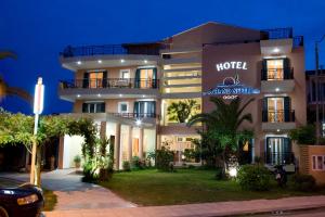 a hotel with a sign that reads hotel champion villa at Hotel Grand Nefeli in Vasiliki