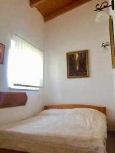 A bed or beds in a room at Villa Flora Lavenda