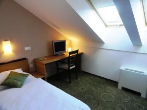 Postel nebo postele na pokoji v ubytování Hotel Bela Krajina