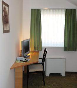 TV a/nebo společenská místnost v ubytování Hotel Bela Krajina
