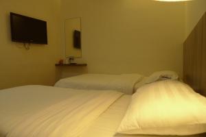 Postel nebo postele na pokoji v ubytování 9 Square Hotel - Petaling Jaya