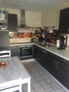 Kuchyň nebo kuchyňský kout v ubytování Kleine Auszeit + 8 fotografií