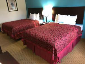 Postel nebo postele na pokoji v ubytování Days Inn & Suites by Wyndham Conroe North