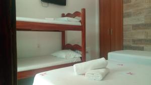 Postel nebo postele na pokoji v ubytování Pousada Coqueiro do Caitá