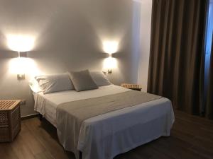 Postel nebo postele na pokoji v ubytování Hotel Cambogia