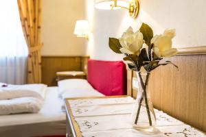 Letto o letti in una camera di Hotel Weisses Lamm
