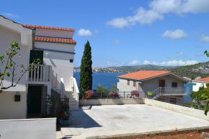 a house with a view of the water at Holiday Apartments Lučić - Feels like Home, away from Home in Ražanj